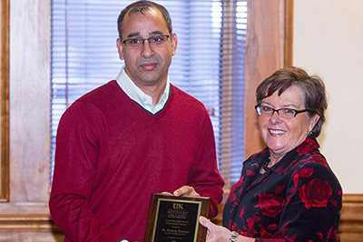 Dr. Pradeep Kachroo, Professor, received the Prestigious Research Paper Award from the College of Agriculture dean, Dr. Nancy Cox, at the Celebration of Land-Grant Research, November 2014. (Photo: Matt Barton, UK)