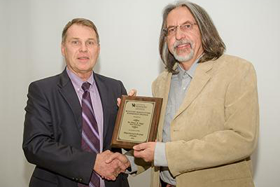 Dr. Peter Nagy, Professor, received the 2016 Prestigious Paper Award at the Futures Lecture and Celebration of Land-Grant Research Program.  Presenting the award is Dr. Rick Bennett, Associate Dean for Research in the College of Agriculture, Food and Environment. (Photo: Matt Barton, UK)
