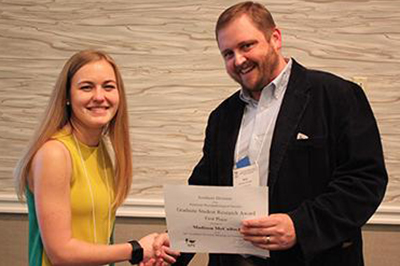 Ms. Madison McCulloch,  Graduate Student, was the first place recipient of the Graduate Student Research Award for her presentation at the 2019 Southern Division American Phytopathological Society meeting.  Presenting the award in February is Nicholas Dufault, Associate Professor at the University of Florida. (Photo: Rodrigo Onofre, University of Florida, and Southern Division-APS Graduate Student Association)