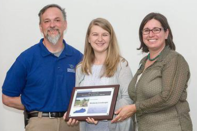 Ms. Kimberly Leonberger, Extension Associate,  was  recognized as the recipient of the 2018 Outstanding Extension Associate by the Kentucky Association of State Extension Professionals (KASEP).  Selection criteria included major program contributions, activities beyond specialty area, and special assignments/involvement.  Presenting the award on April 13, 2018 are Dr. Nicole Gauthier, Associate Extension Professor and KASEP President, and Dr. Gregg Rentfrow, Extension Associate Professor and KASEP Awards Chair. (Photo: Steve Patton, UK)